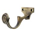 Antique brass curtain pole centre bracket front view